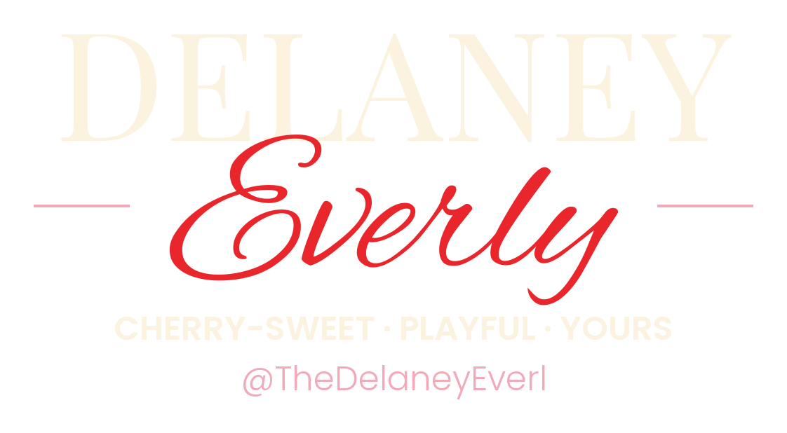 Delaney Everly wordmark, cream on dark